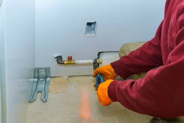 Man installing a Appliance Gas
