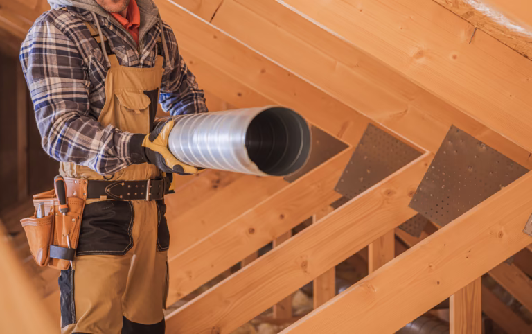 HVAC Worker with Piece of Air Duct Pipeline in His Hands
