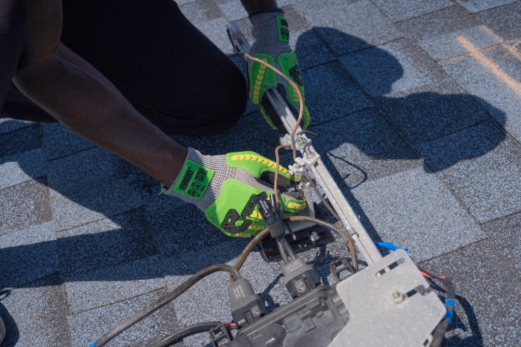 technician performing chimney cap installation on a steep Florida roofline