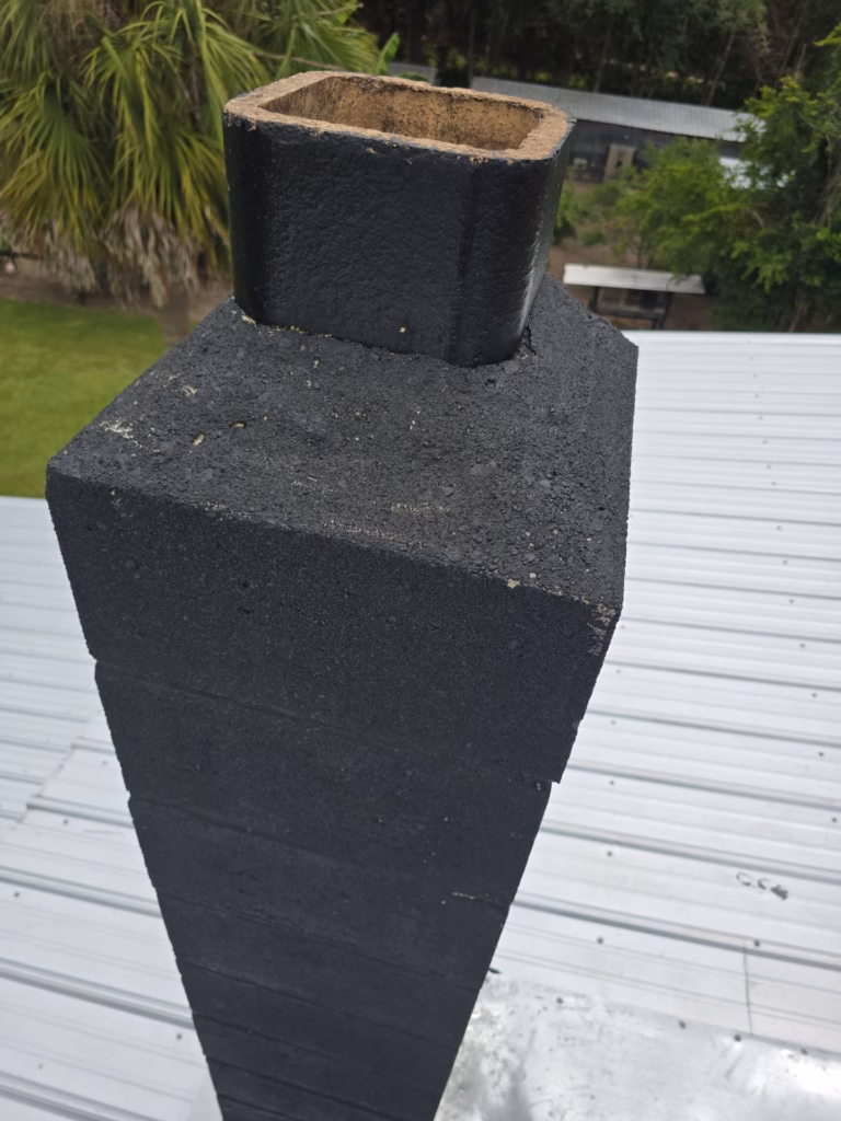 technician inspecting a cracked flue liner during chimney relining crystal river fl service