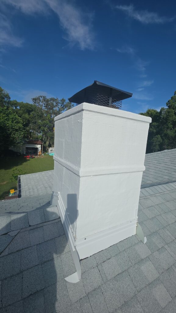 certified technician measuring clearance for chimney mantels above a firebox