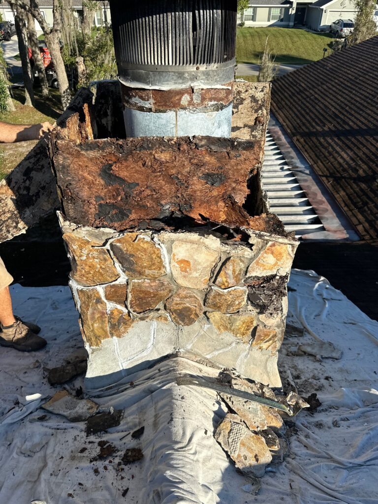 cutaway diagram showing wood chimney framing details around a metal flue with proper air gap
