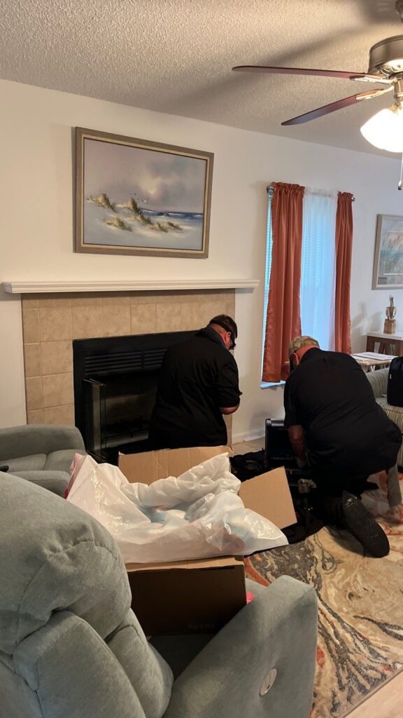 homeowner reviewing fireplaces options with a certified technician in an Ocala living room