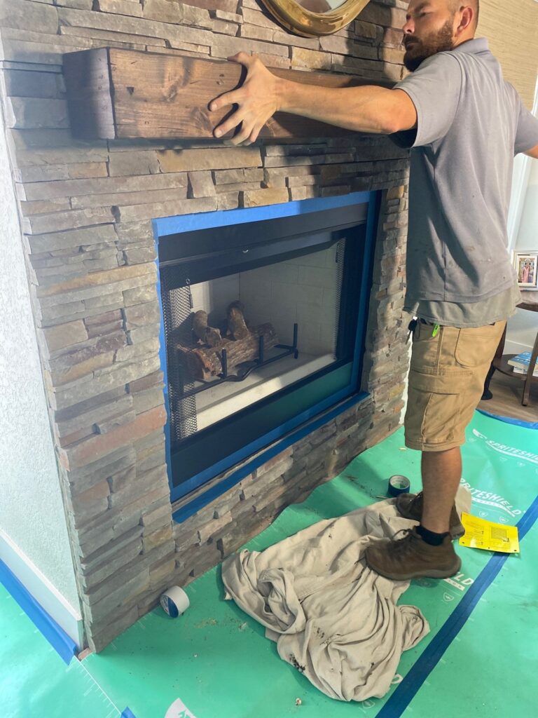 licensed technician checking electrical clearance before fireplace insert installation