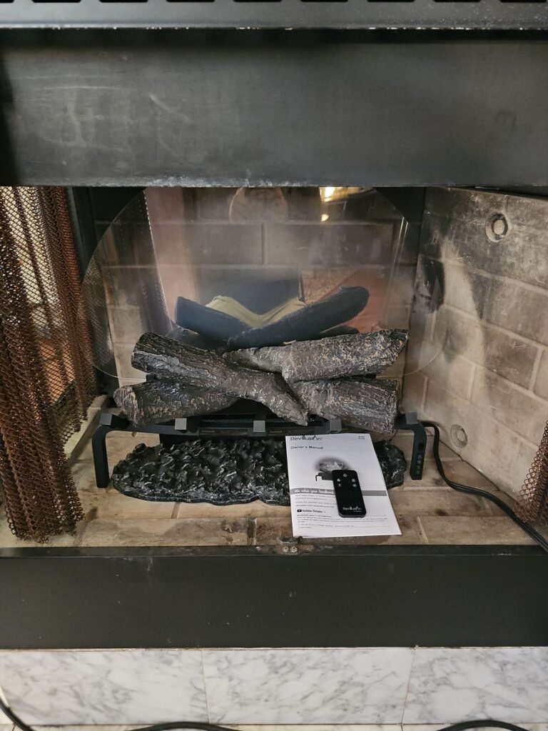 licensed technician checking electrical panel before electric fireplace install
