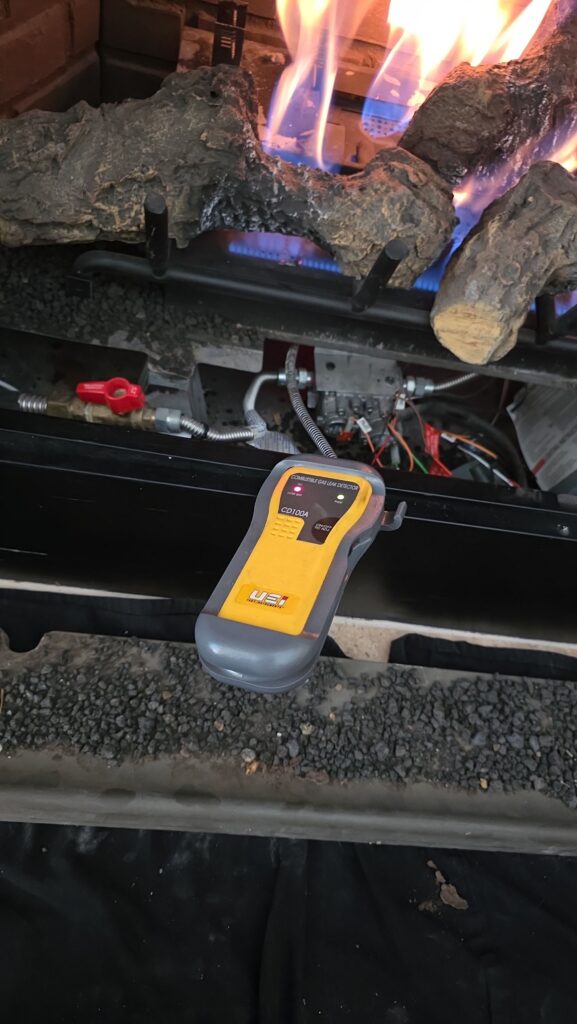 Finding a Reliable Gas Fireplace Near Me in Marion County 3 licensed technician testing gas line after fireplace installed in Ocala home