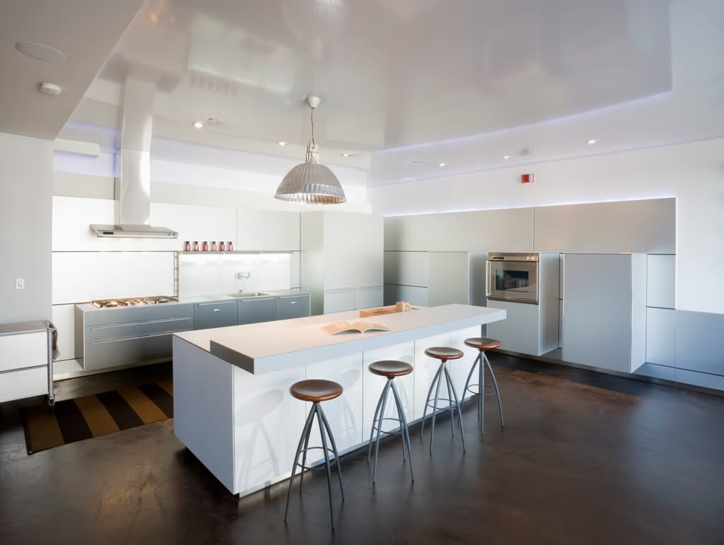 Modern remodeled kitchen with an island and updated cabinetry by Always Home Repair