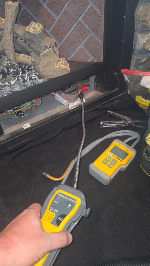 Finding a Reliable Gas Fireplace Near Me in Marion County 2 technician running gas line for new gas fireplace installation