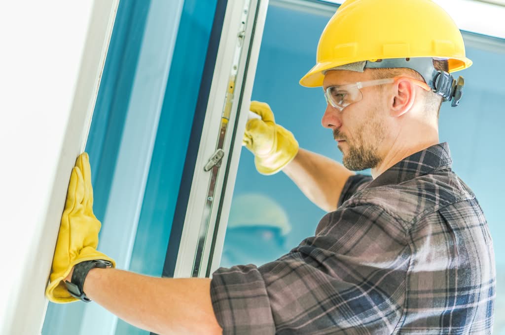 Contractor installing a new window for Always Home Repair windows and doors service
